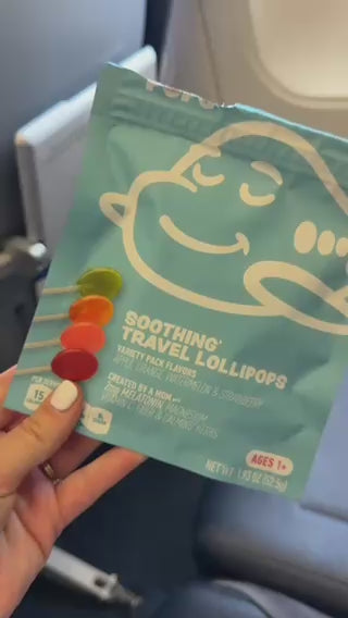 Family travel day with AIRLINEPOPS: lollipop at the window seat, boarding, and kids napping on the plane